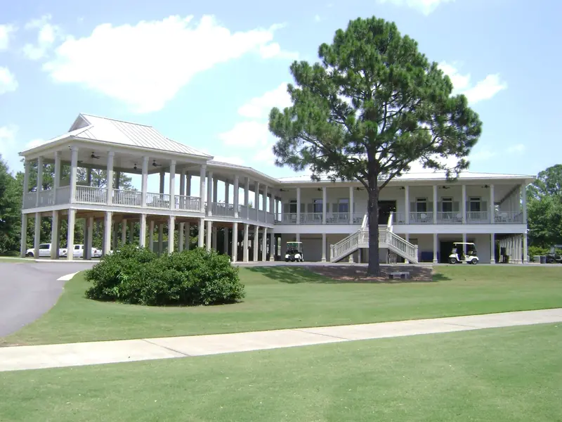 The clubhouse and its wraparound verandas seen from the lawn
